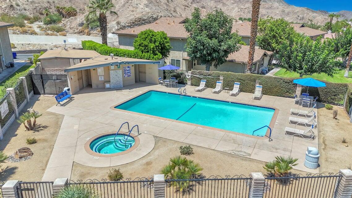 72682 Thrush Road, Unit 1 Palm Desert, CA 92260 - Photo 12 of 40 an aerial view of a house with swimming pool and patio