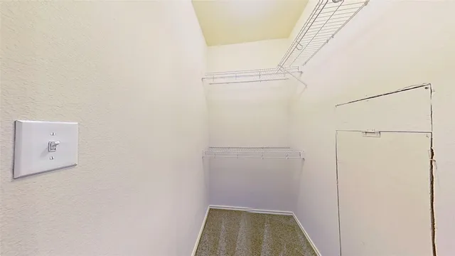 a spacious bathroom with a double vanity sink mirror and toilet