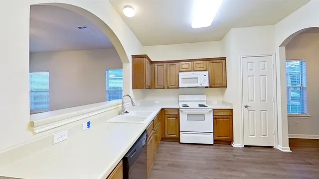a kitchen with a stove and a sink