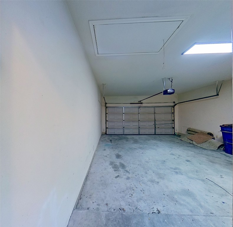 308 Rinehardt Street Hutto, TX 78634 - Photo 26 of 30 Garage featuring a garage door opener