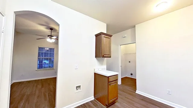 view of hall way with wooden floor