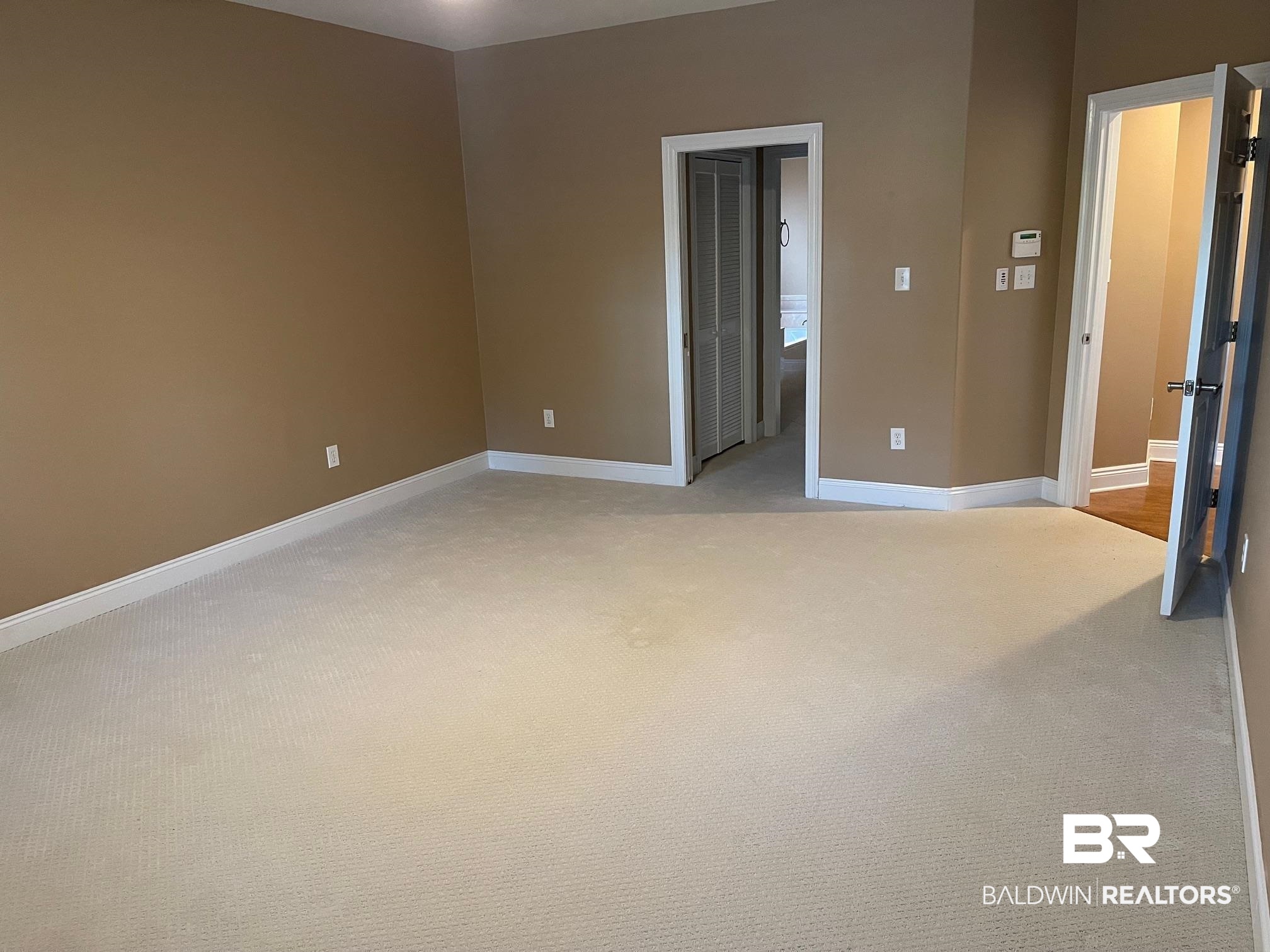 109 Savannah Circle Foley, AL 36535 - Photo 12 of 17 Unfurnished room with light colored carpet