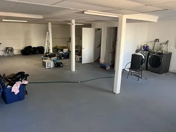 a room with gym equipment and a window