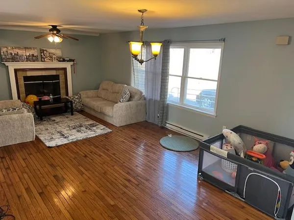 a living room with furniture and a fireplace
