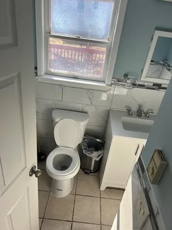 a bathroom with a toilet and a sink