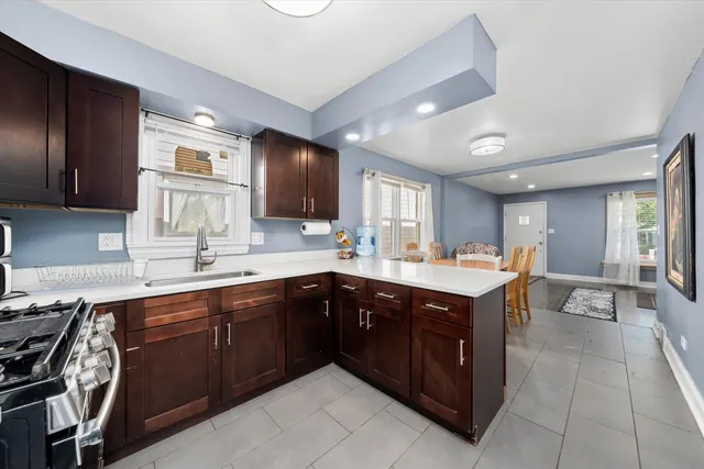a kitchen with a sink counter top space and appliances