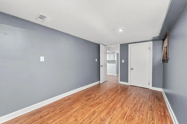 a view of a cars park in front of a building