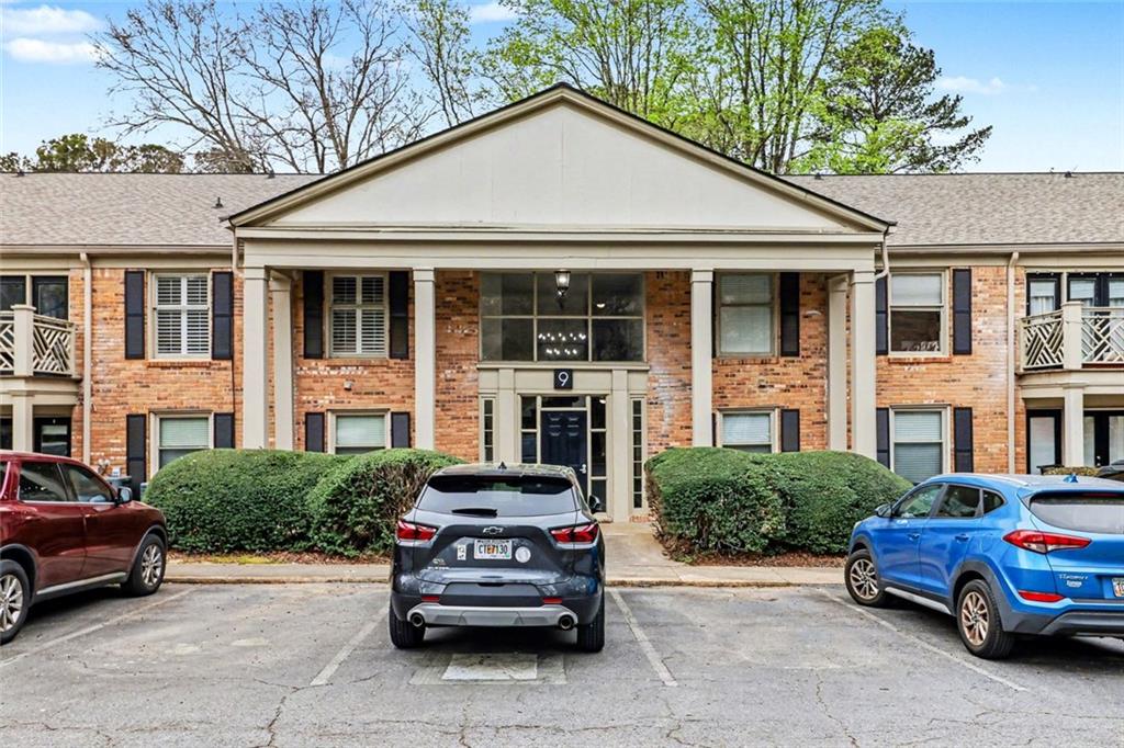a car parked in front of a brick house