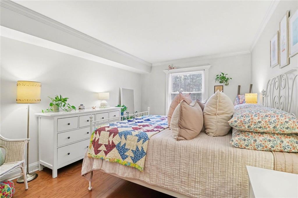 3650 Ashford Dunwoody Road Northeast, Unit 904 Atlanta, GA 30319 - Photo 20 of 33 a bedroom with a bed and a dresser