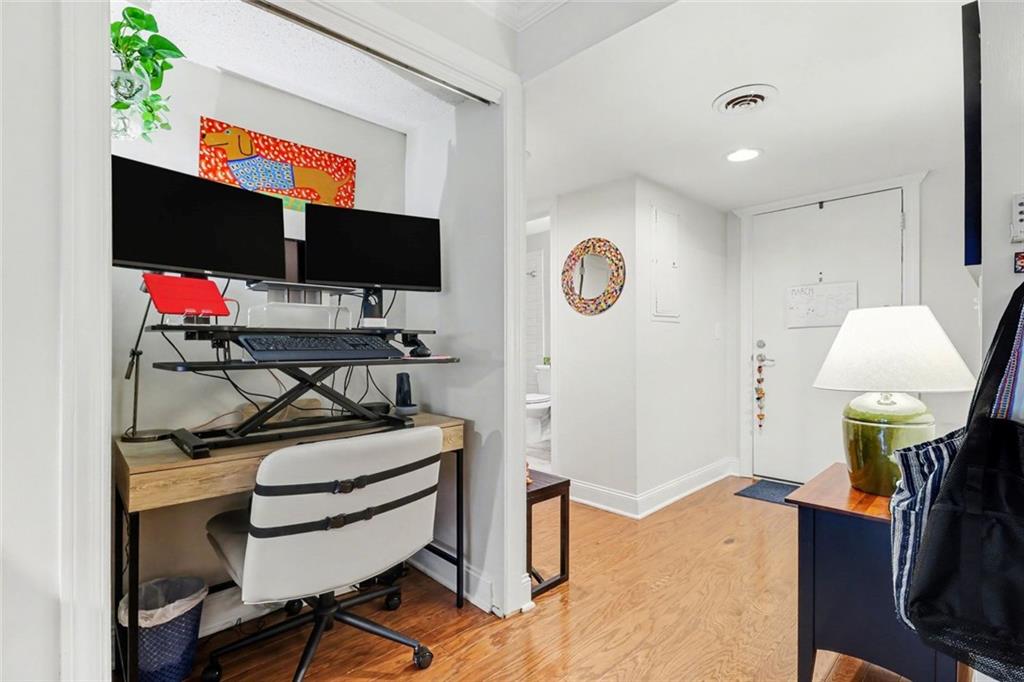 3650 Ashford Dunwoody Road Northeast, Unit 904 Atlanta, GA 30319 - Photo 24 of 33 a room with furniture and a flat screen tv