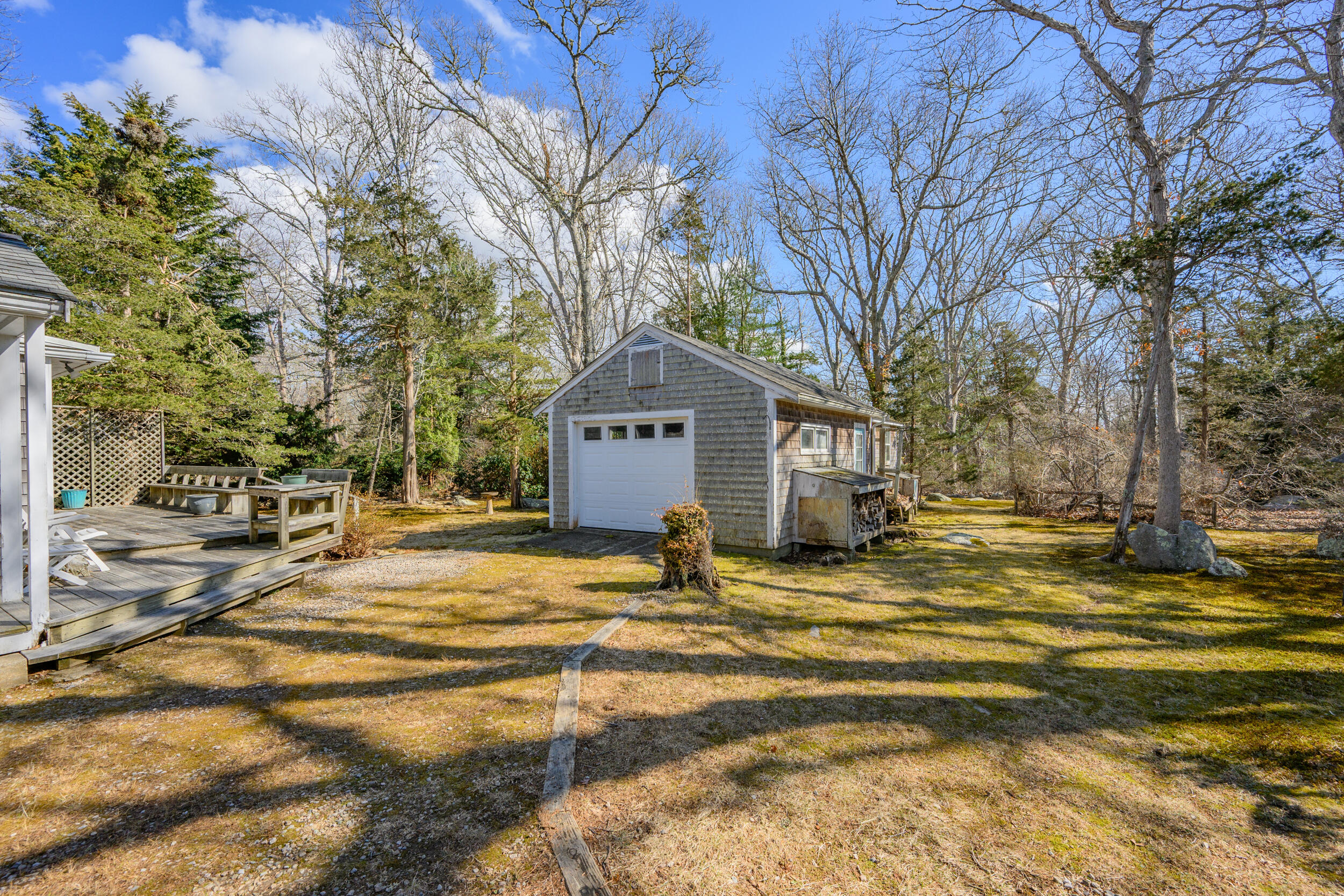 13 Hidden Village Road West Falmouth, MA 02540 - Photo 12 of 31 a front view of a house with a yard and trees
