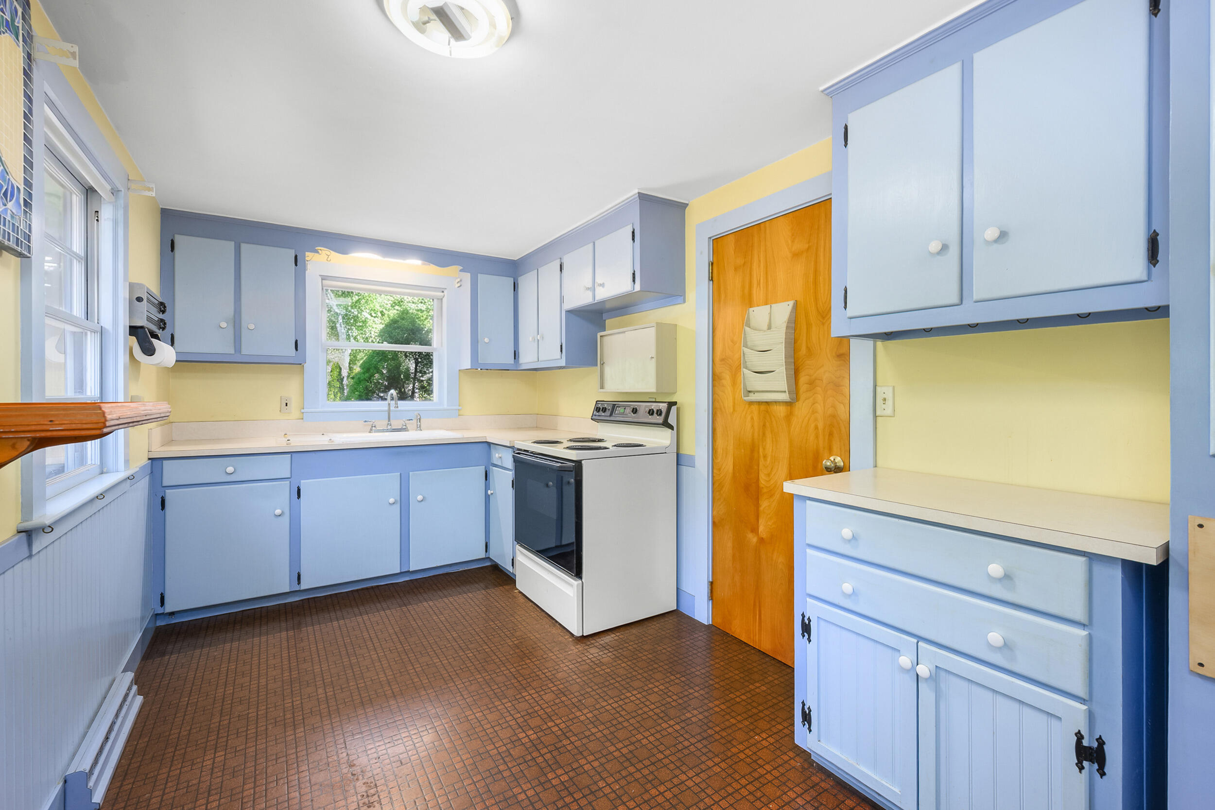 13 Hidden Village Road West Falmouth, MA 02540 - Photo 18 of 31 a kitchen with granite countertop white cabinets and white appliances