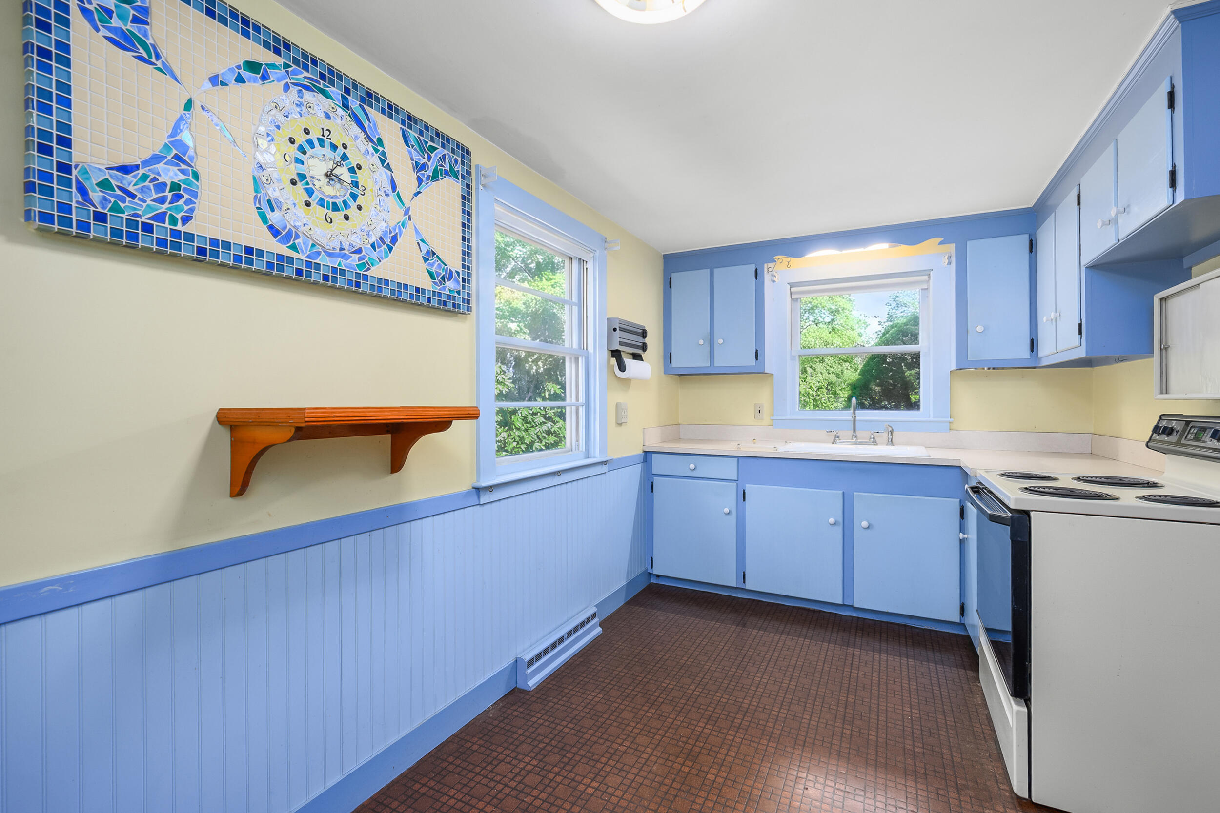 13 Hidden Village Road West Falmouth, MA 02540 - Photo 19 of 31 a kitchen with granite countertop a stove a sink and a microwave