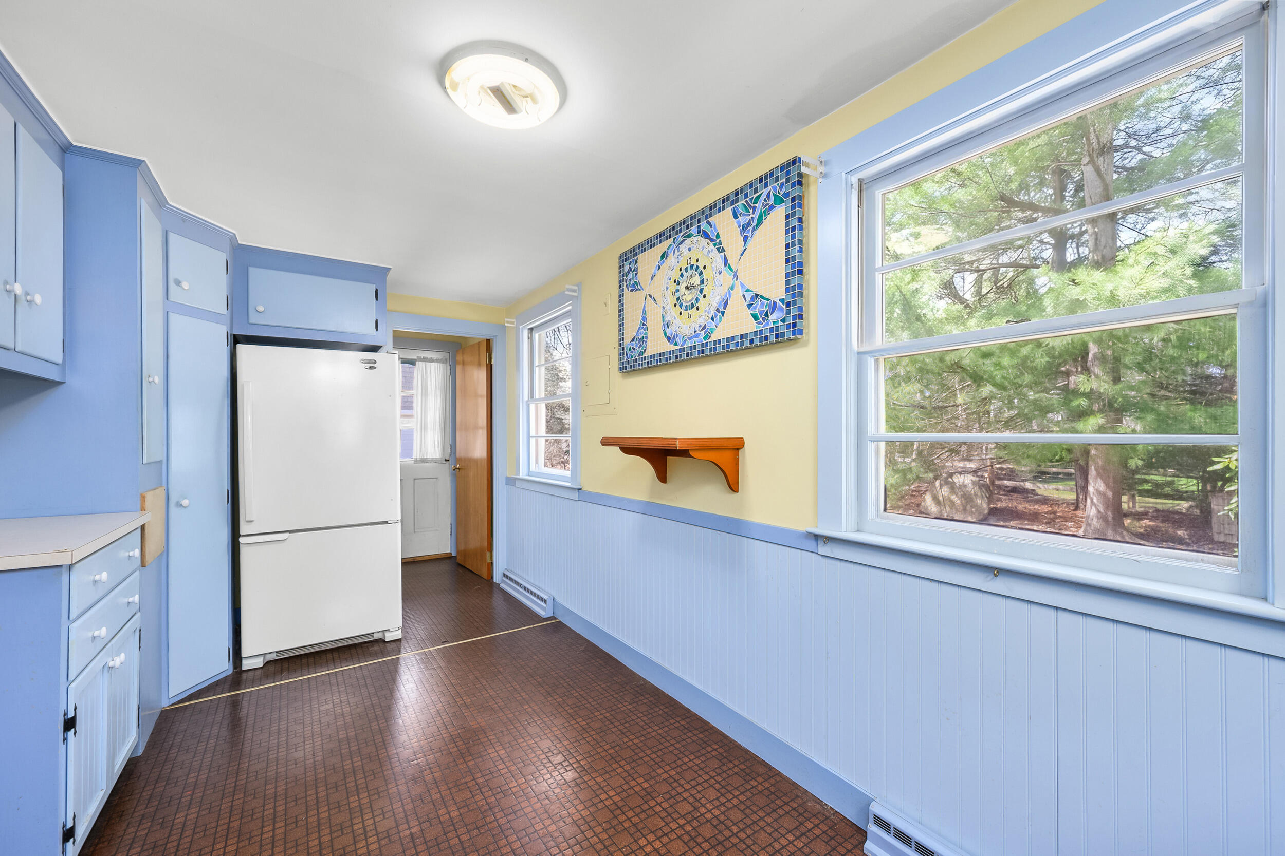 13 Hidden Village Road West Falmouth, MA 02540 - Photo 20 of 31 a kitchen with stainless steel appliances a refrigerator and a large window