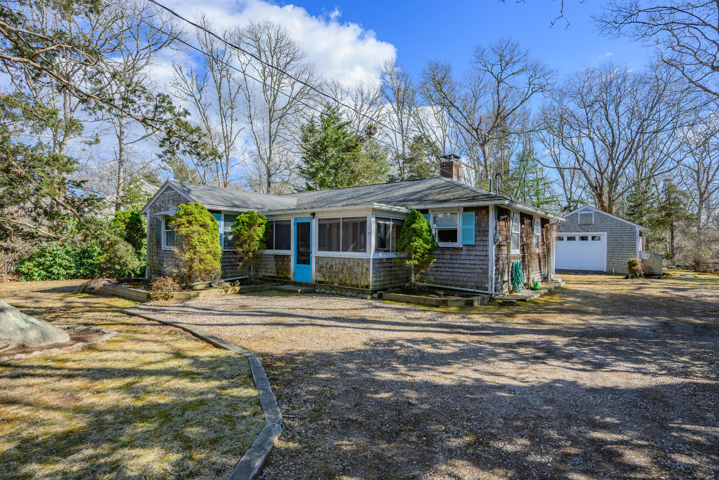 13 Hidden Village Road West Falmouth, MA 02540 - Photo 7 of 31 a front view of a house with a garden