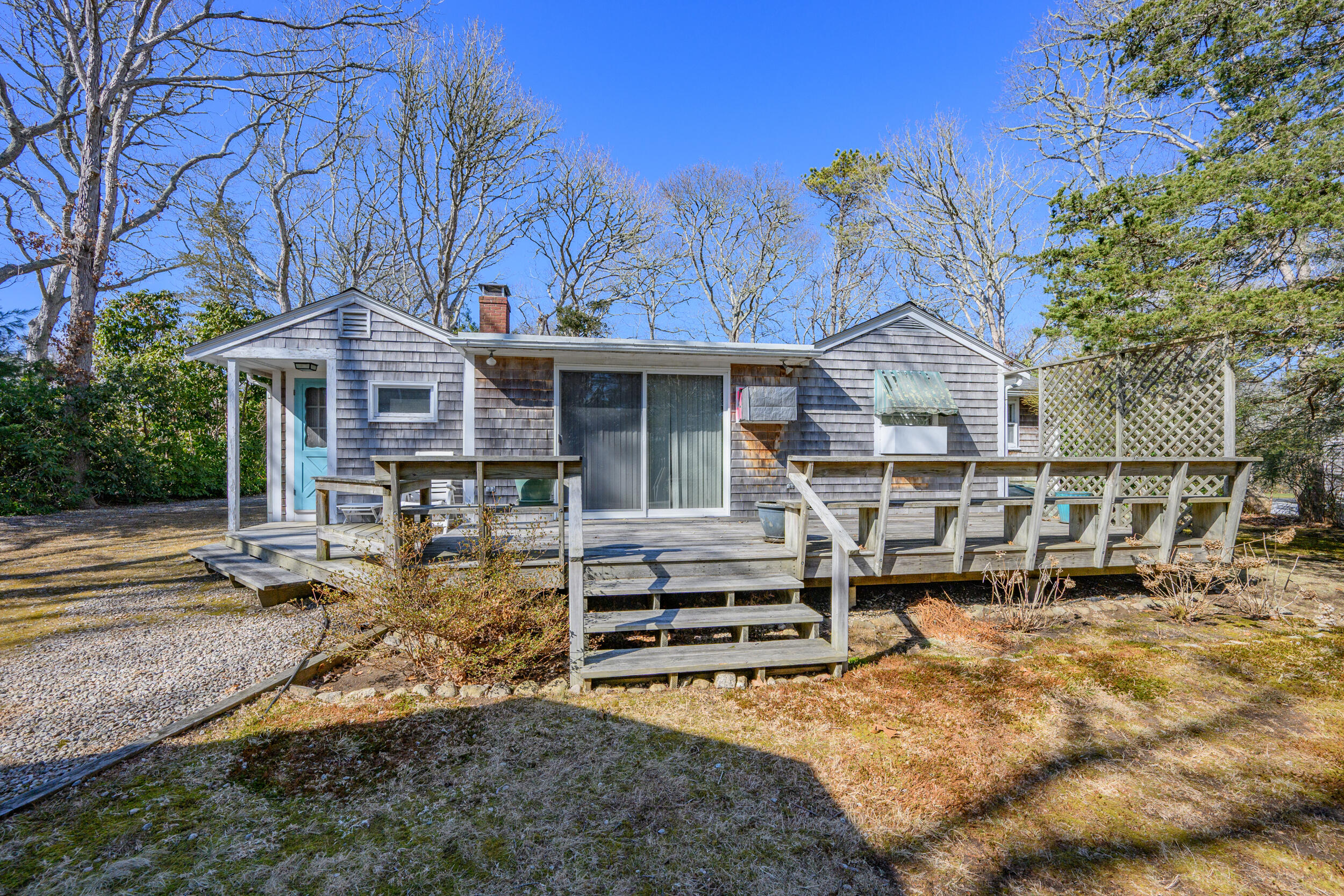 13 Hidden Village Road West Falmouth, MA 02540 - Photo 9 of 31 front view of a house with a large tree