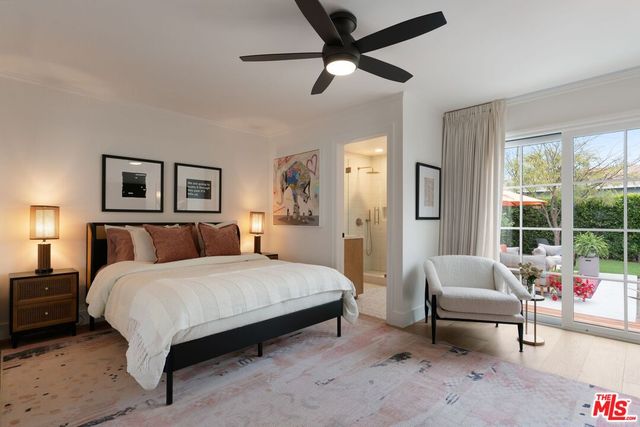 a spacious bedroom with a bed and a couch