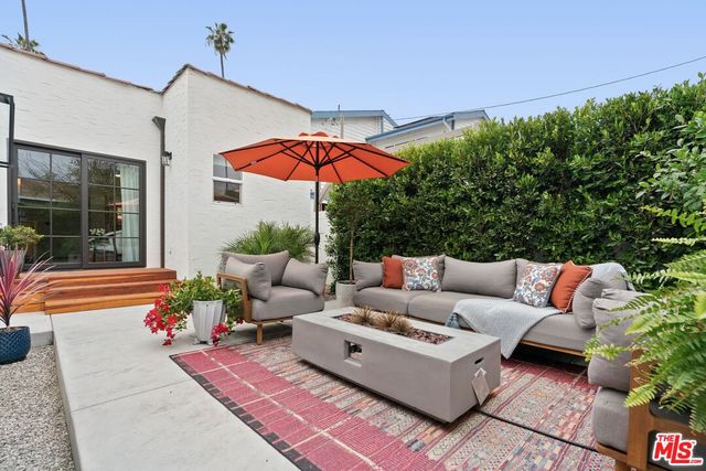a outdoor living space with furniture potted plant and outdoor seating