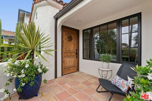 a view of an outdoor space with furniture and garden