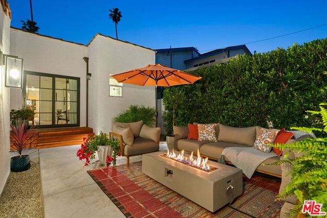 a outdoor living space with furniture and a potted plant