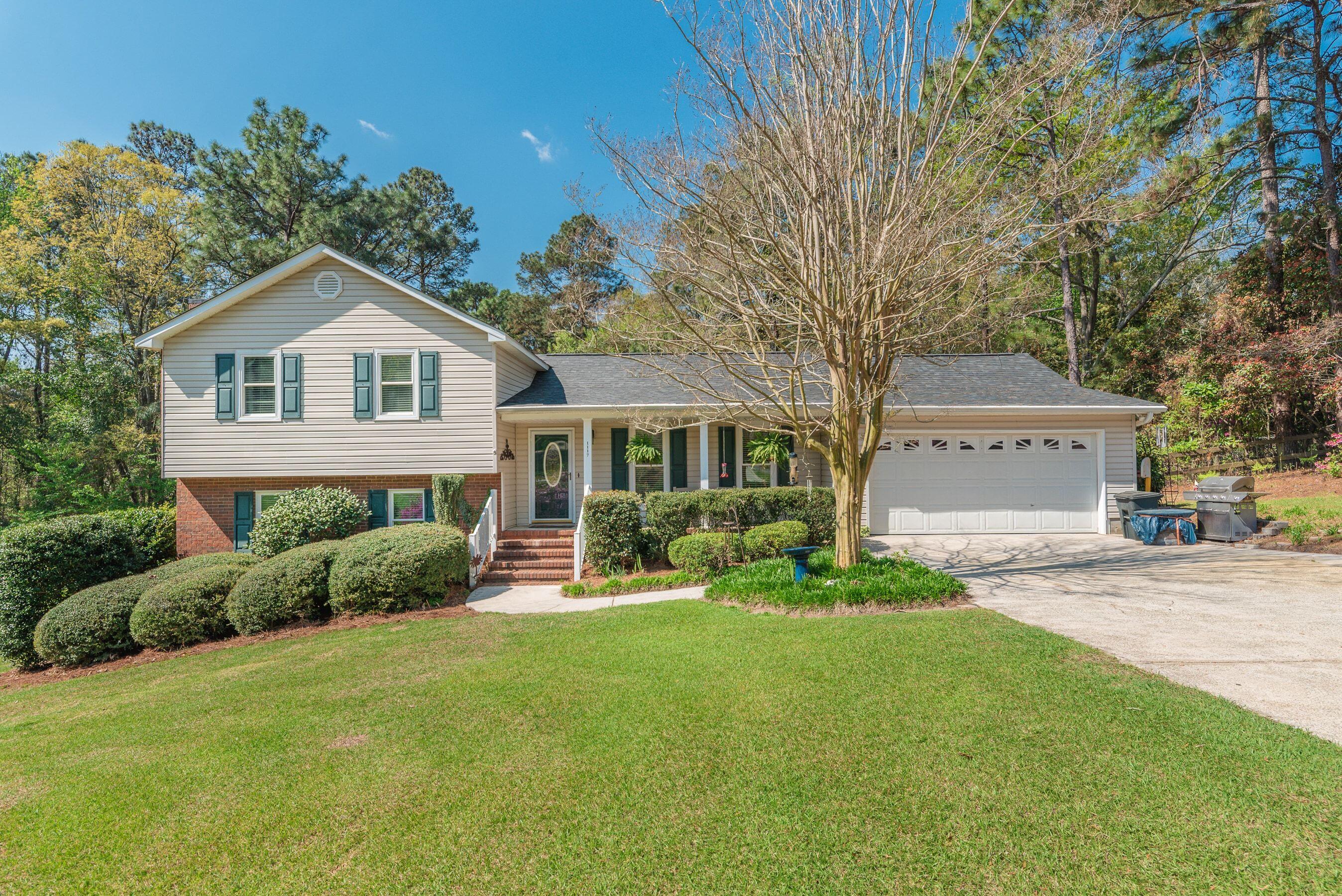 1117 Ridgemont Drive Aiken, SC 29803 - Photo 2 of 49 a front view of a house with a yard and garage