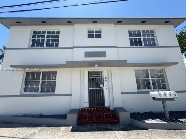 a front view of a house with glass windows