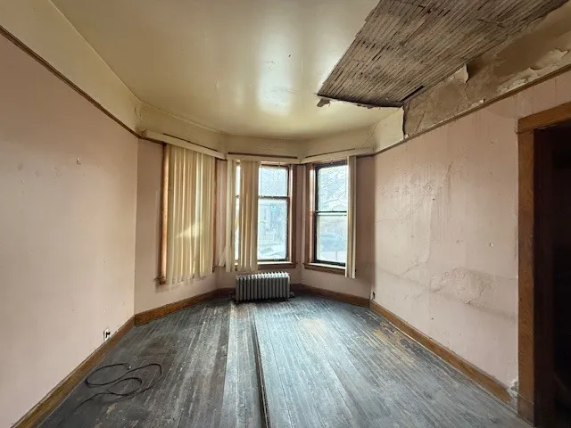 a view of a room with gym equipment and a large window