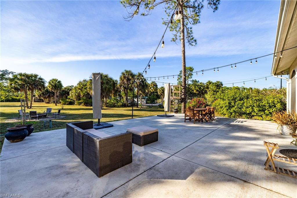 461 Everglades Boulevard North Naples, FL 34120 - Photo 15 of 16 View of patio with outdoor dining area
