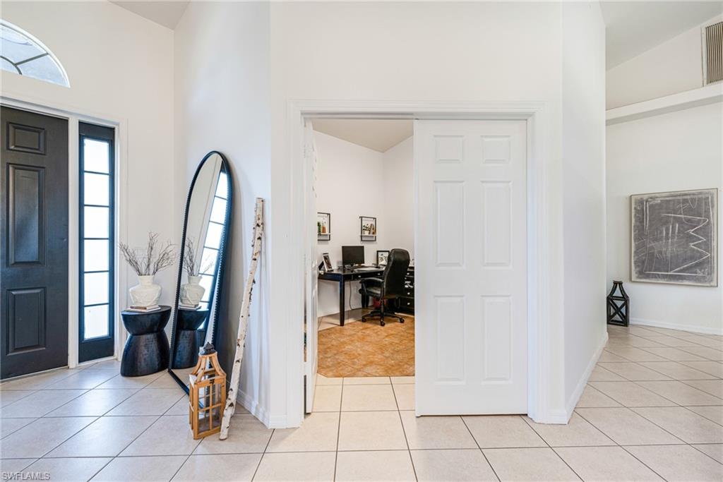 461 Everglades Boulevard North Naples, FL 34120 - Photo 2 of 16 Foyer entrance featuring light tile patterned flooring