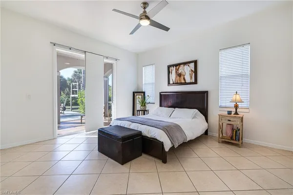 a spacious bedroom with a bed and a window