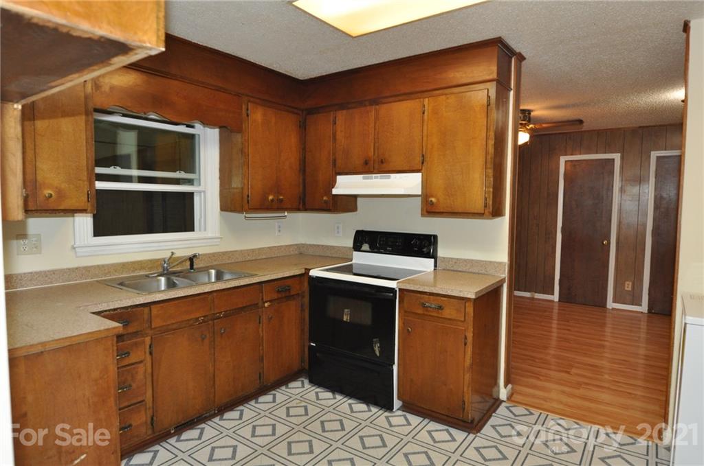 801 Charity Road, Unit 6 Chester, SC 29706 - Photo 8 of 26 a kitchen with a stove sink and cabinets