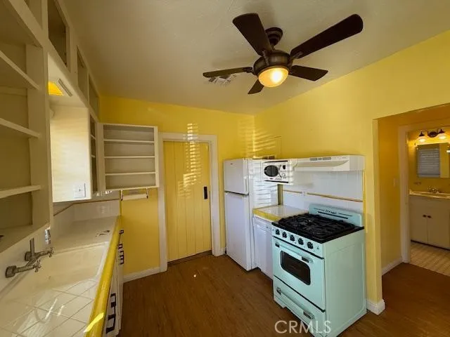 a kitchen with a stove and a sink
