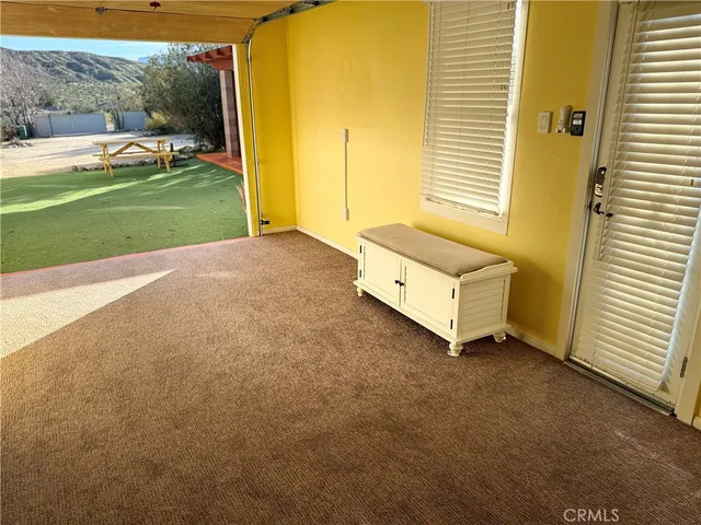 a bed room with a bed and a window