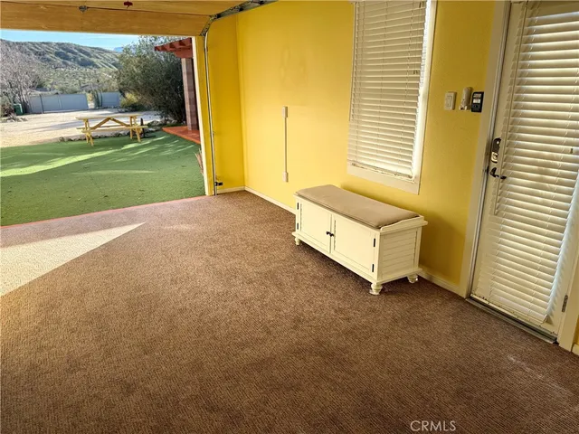 a bed room with a bed and a window