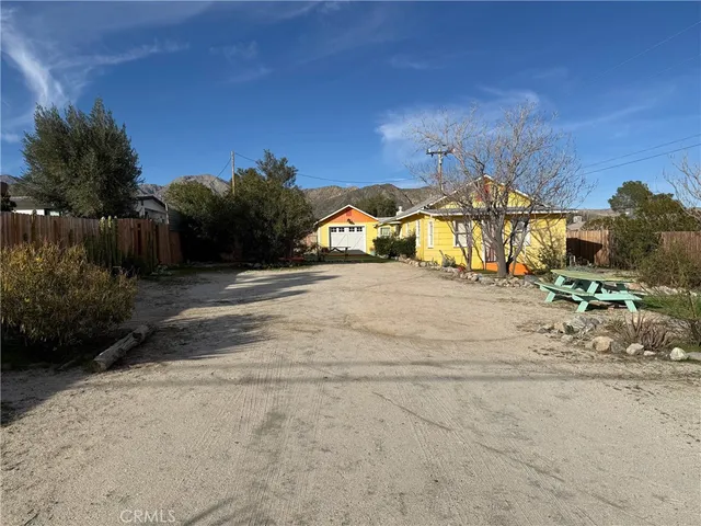 a view of a road with a building in the background