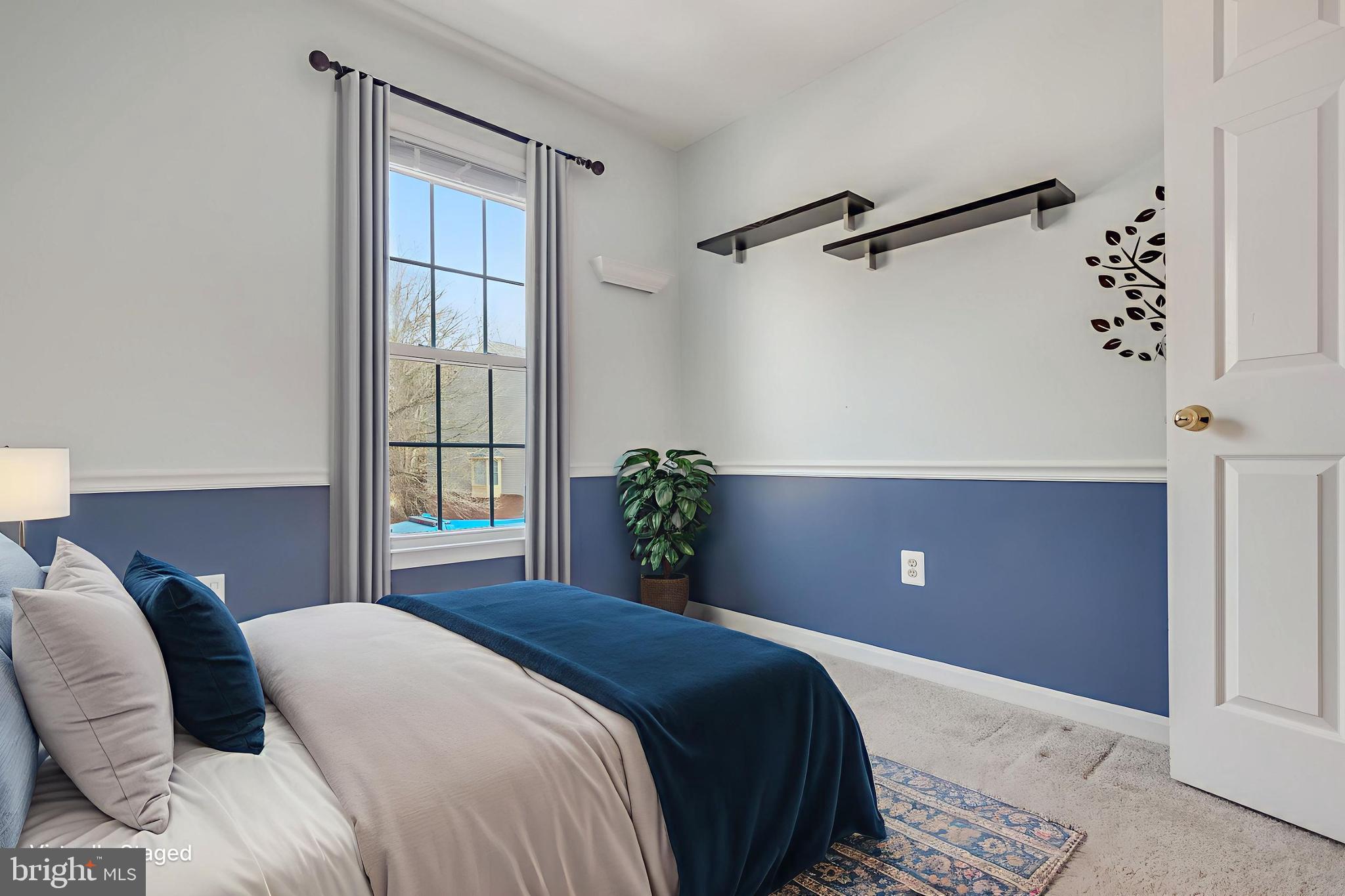 8735 Stone Hill Place Springfield, VA 22153 - Photo 11 of 51 a bedroom with a bed and a window