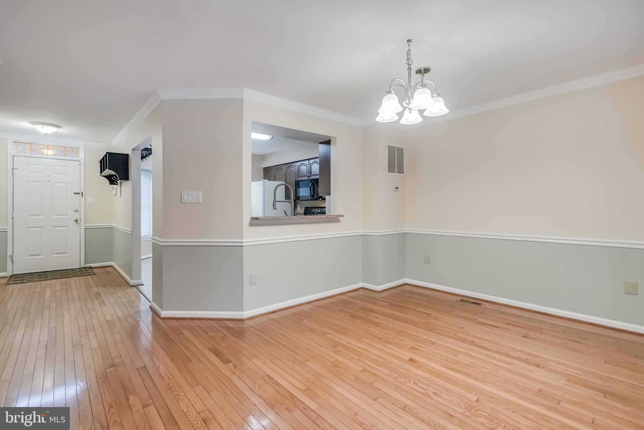 8735 Stone Hill Place Springfield, VA 22153 - Photo 20 of 51 wooden floor in an empty room with a window