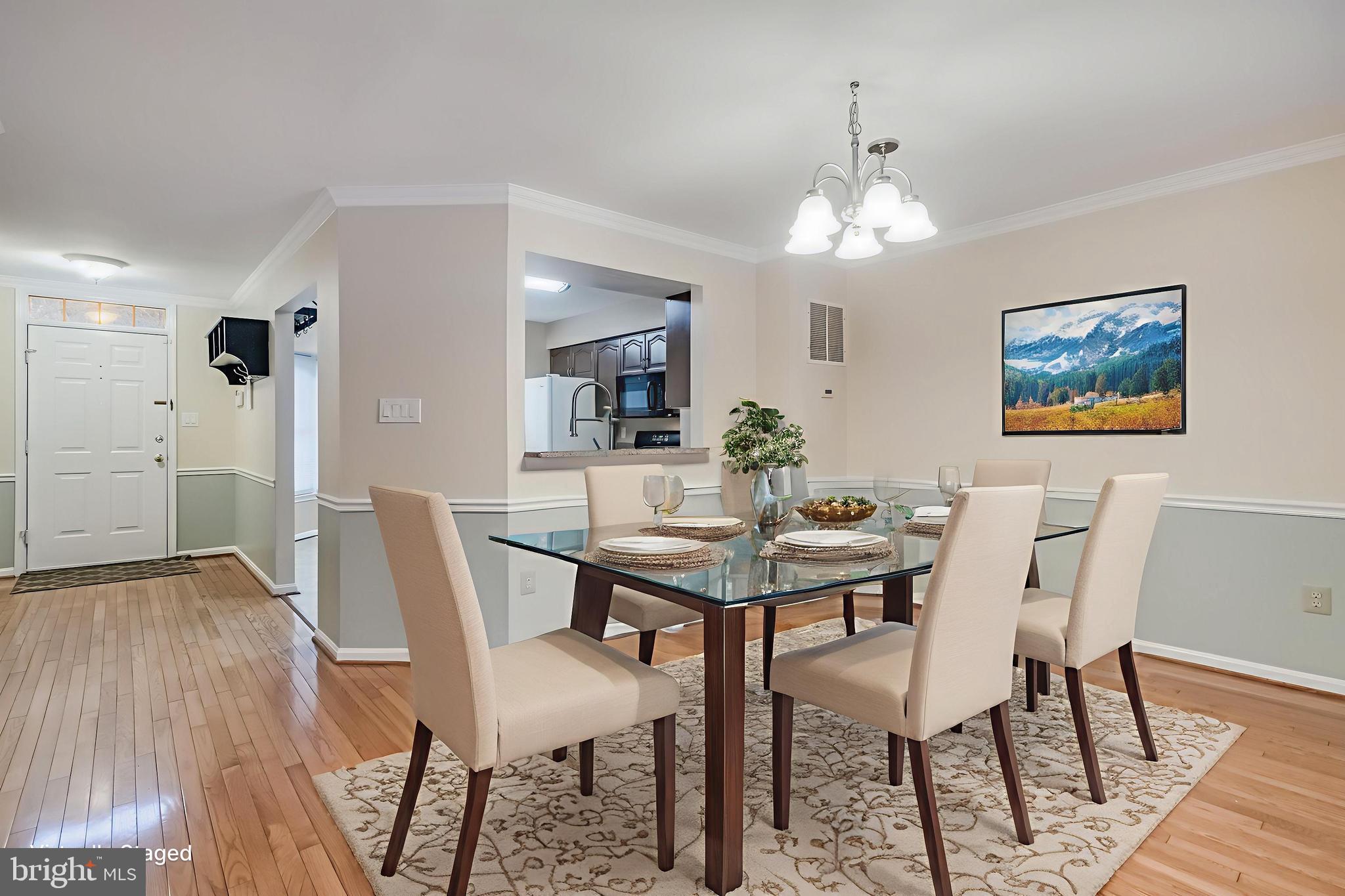 8735 Stone Hill Place Springfield, VA 22153 - Photo 2 of 51 a view of a dining room with furniture and wooden floor