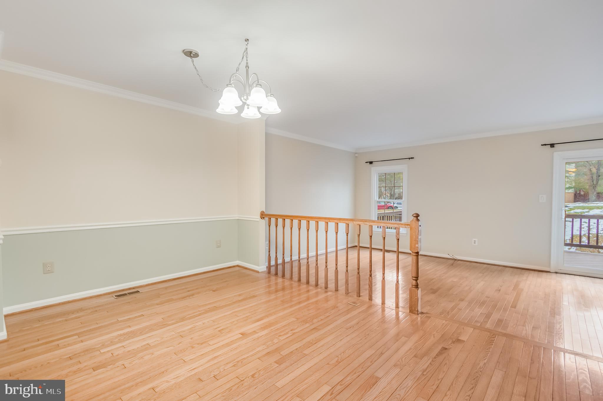 8735 Stone Hill Place Springfield, VA 22153 - Photo 22 of 51 a view of empty room with wooden floor and fan