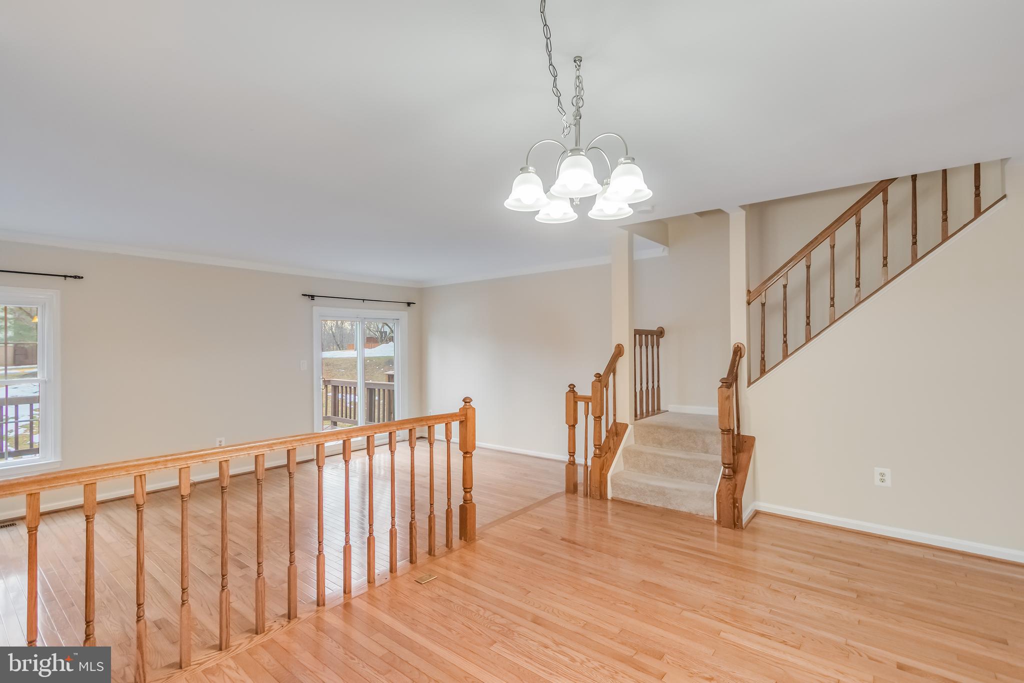 8735 Stone Hill Place Springfield, VA 22153 - Photo 23 of 51 a view of entryway and hall with wooden floor