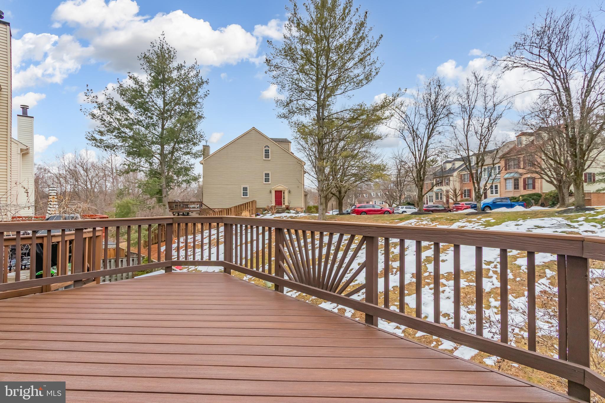 8735 Stone Hill Place Springfield, VA 22153 - Photo 27 of 51 a view of wooden deck and a backyard