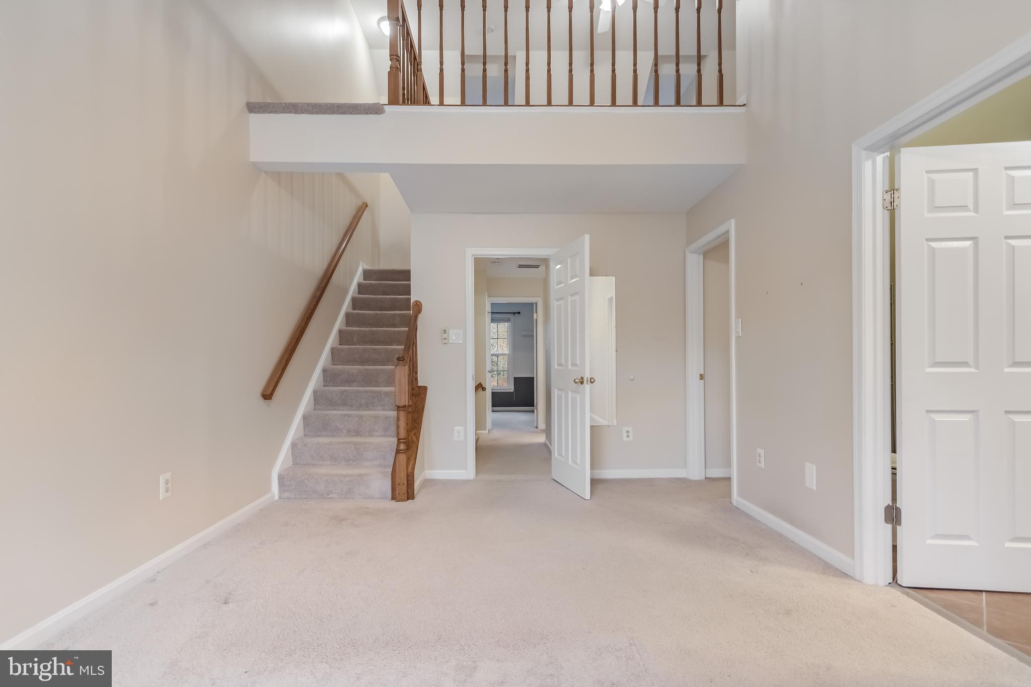 8735 Stone Hill Place Springfield, VA 22153 - Photo 29 of 51 a view of an entryway with stairs