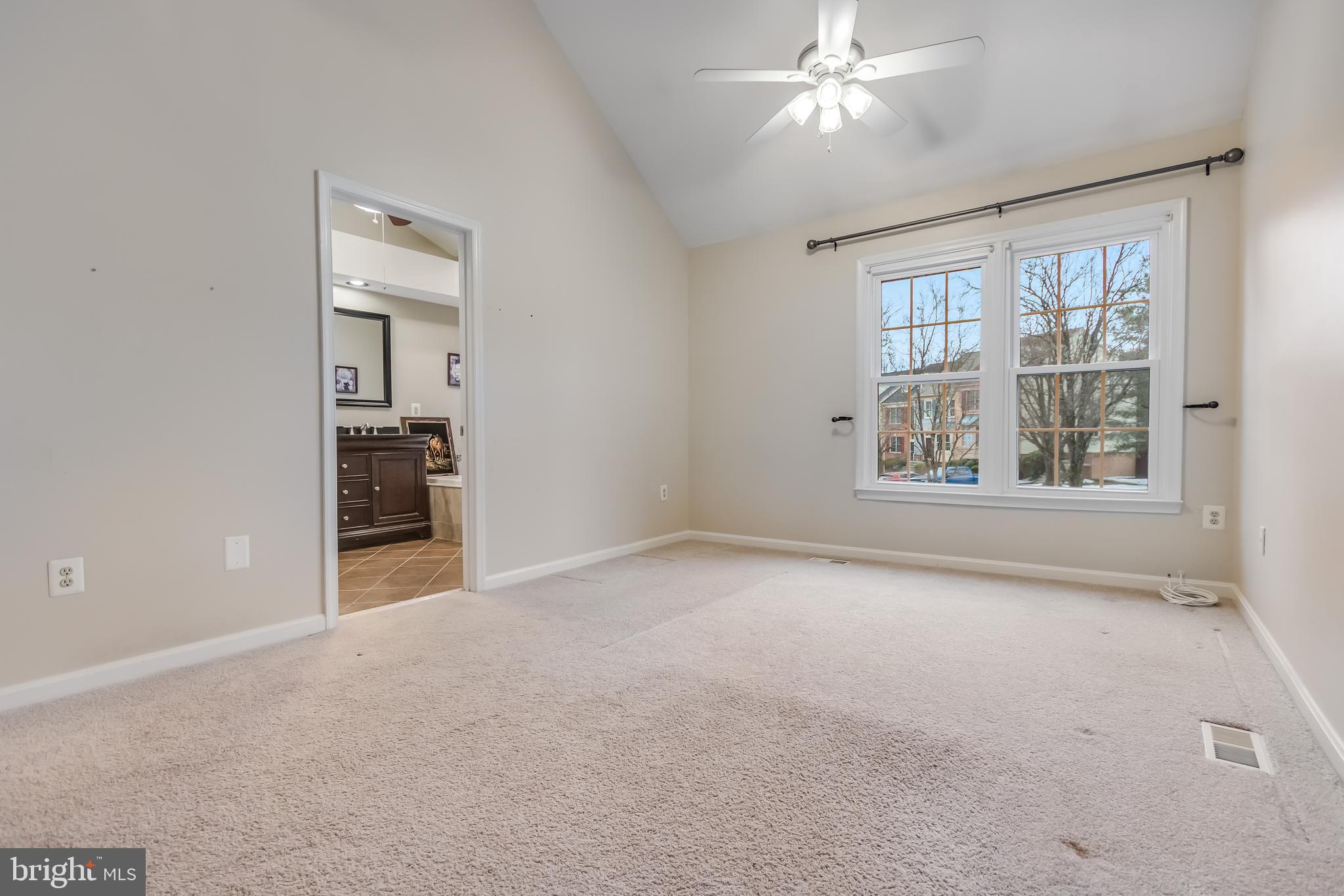 8735 Stone Hill Place Springfield, VA 22153 - Photo 30 of 51 an empty room with chandelier fan and windows