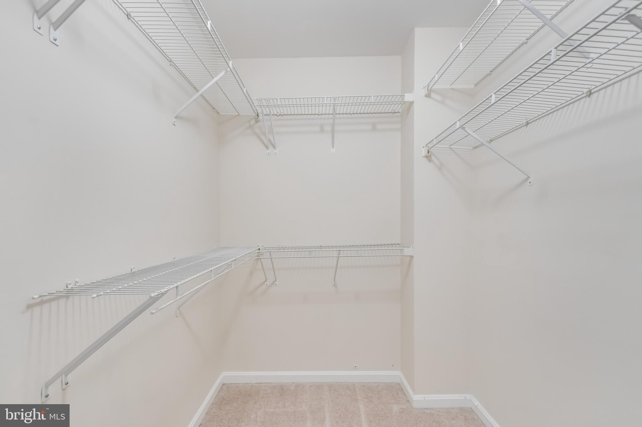 8735 Stone Hill Place Springfield, VA 22153 - Photo 31 of 51 a view of an empty walk in closet