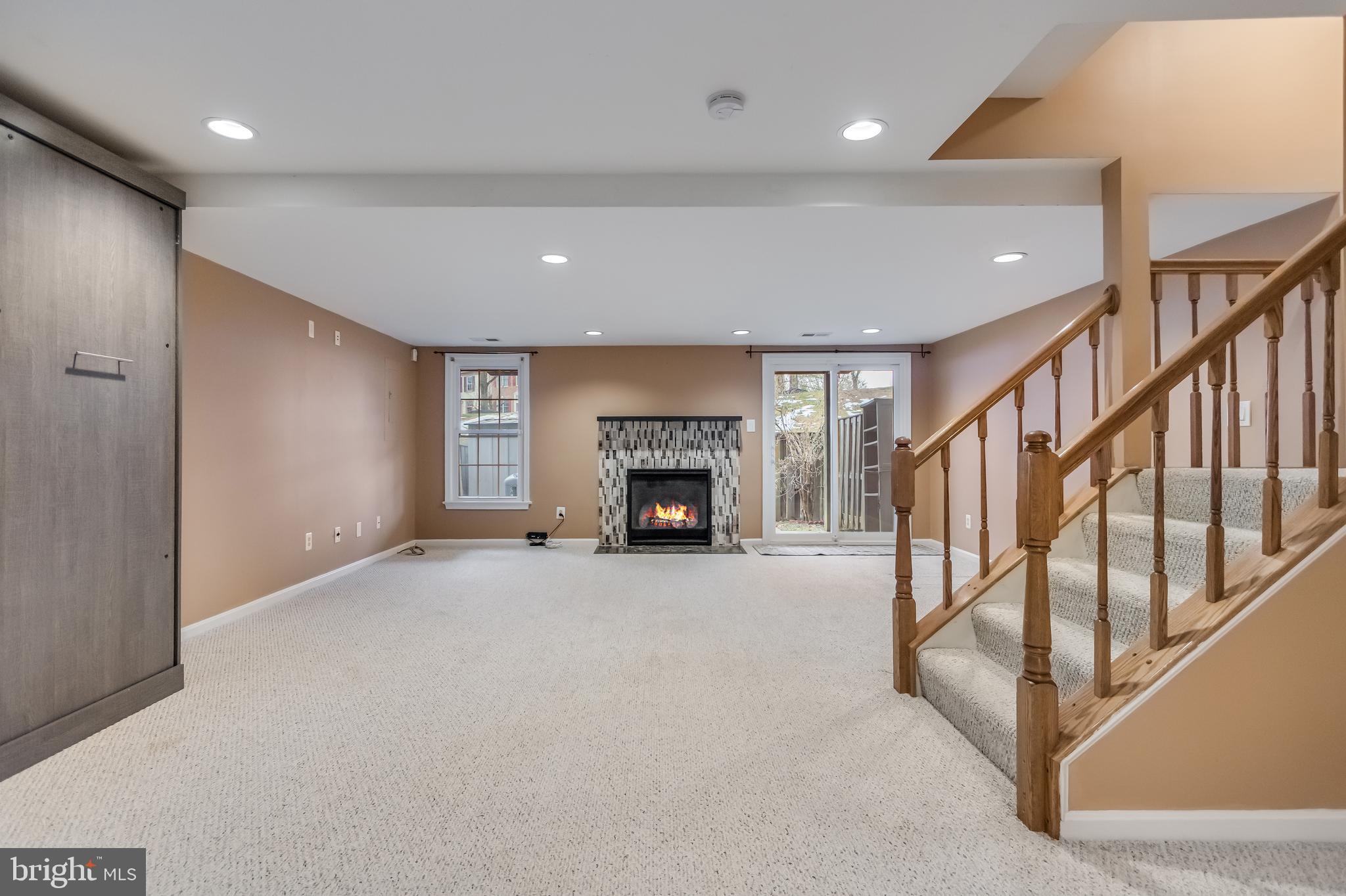 8735 Stone Hill Place Springfield, VA 22153 - Photo 44 of 51 a view of an empty room with a fireplace