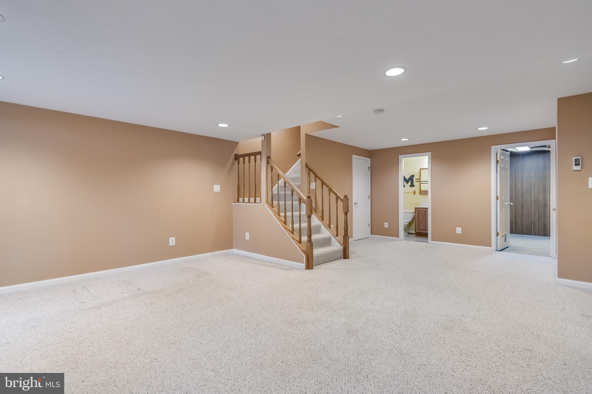 8735 Stone Hill Place Springfield, VA 22153 - Photo 45 of 51 a view of an empty room with wooden floor