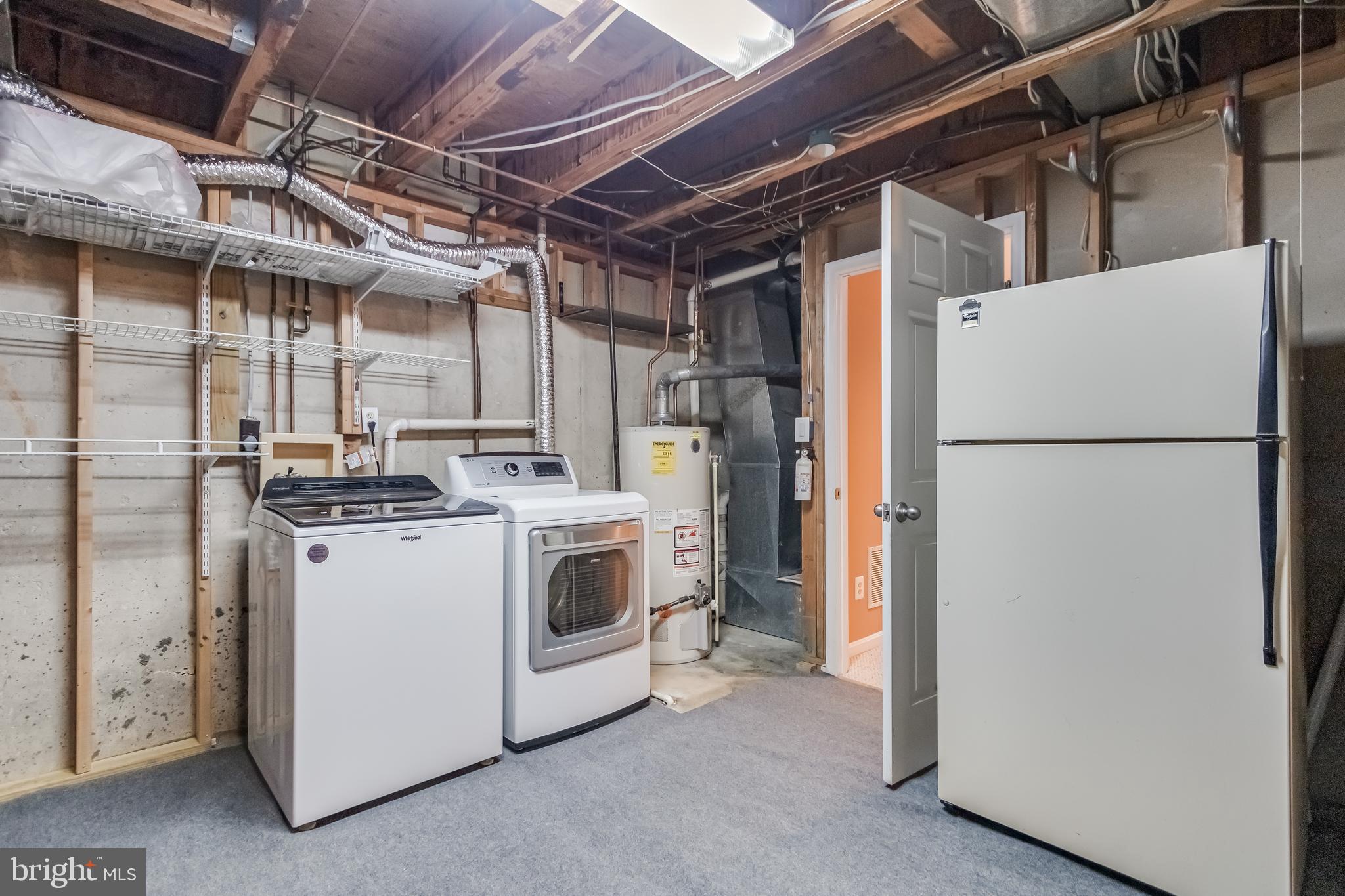 8735 Stone Hill Place Springfield, VA 22153 - Photo 47 of 51 a utility room with dryer and washer
