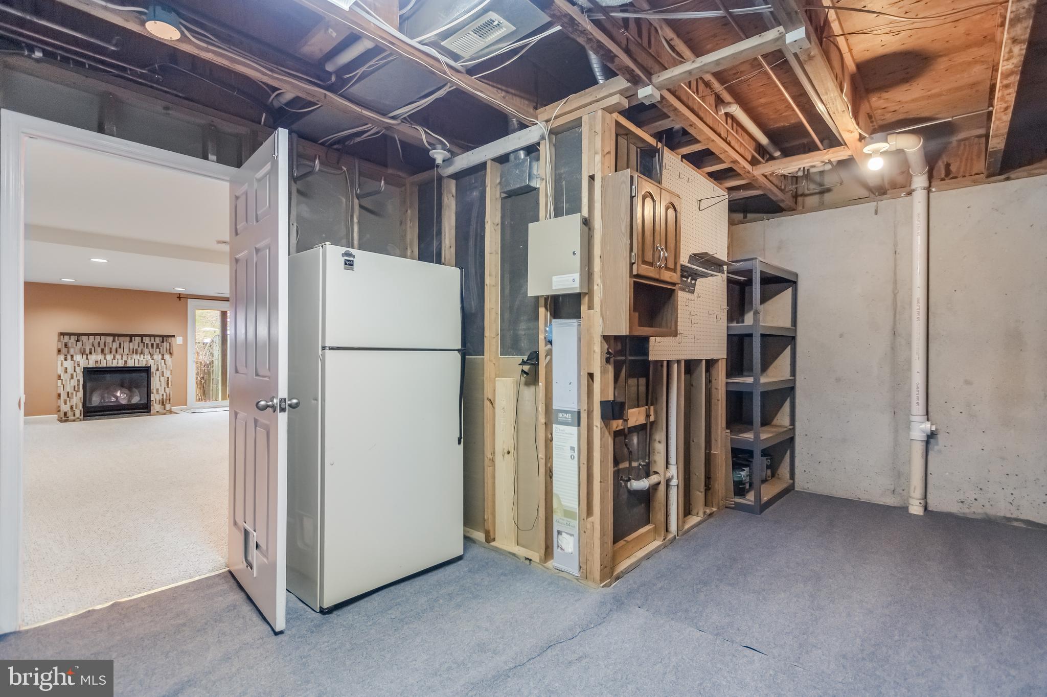8735 Stone Hill Place Springfield, VA 22153 - Photo 48 of 51 a view of a storage & utility room with refrigerator
