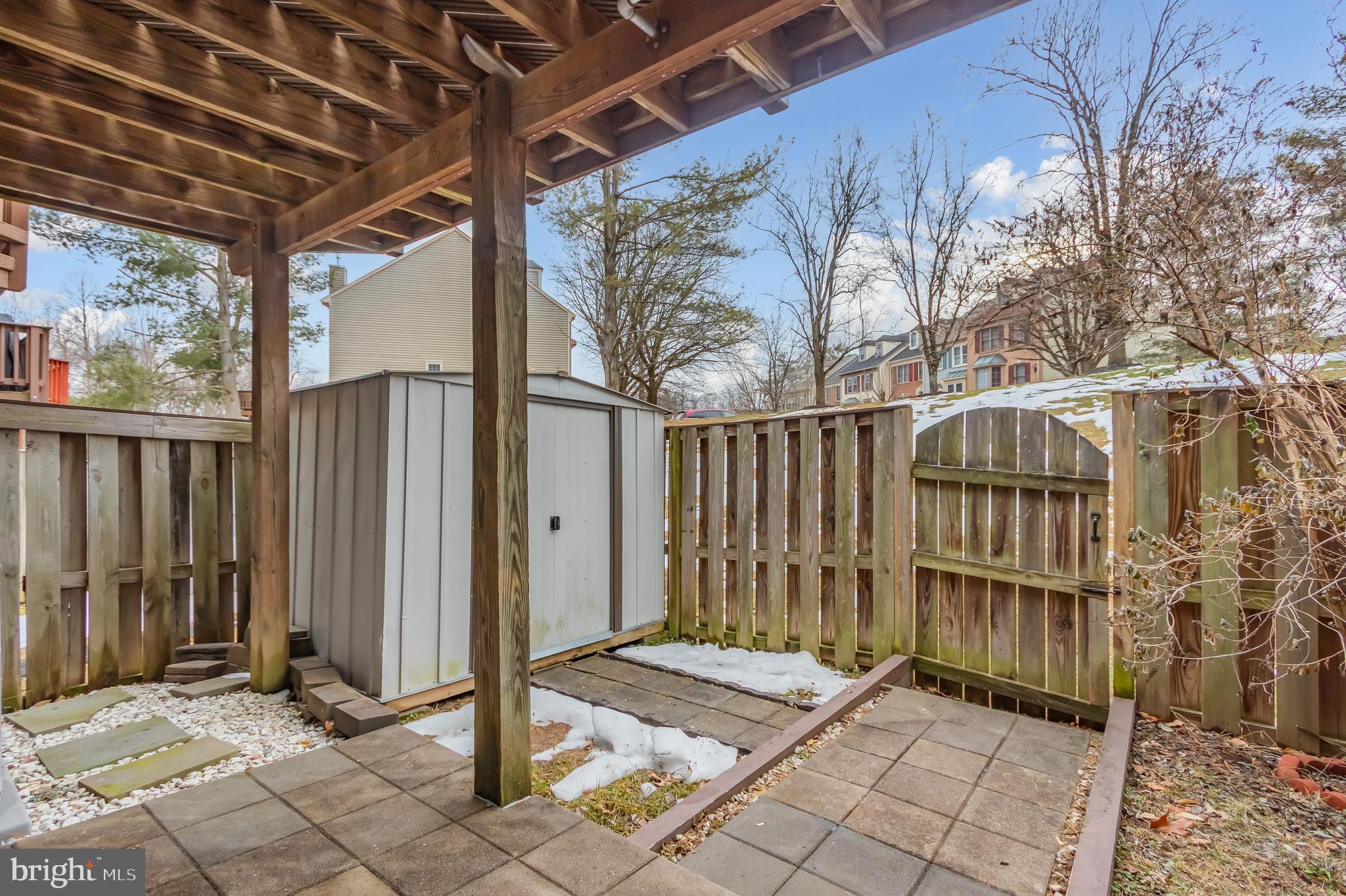 8735 Stone Hill Place Springfield, VA 22153 - Photo 49 of 51 a view of a wooden door with a bench