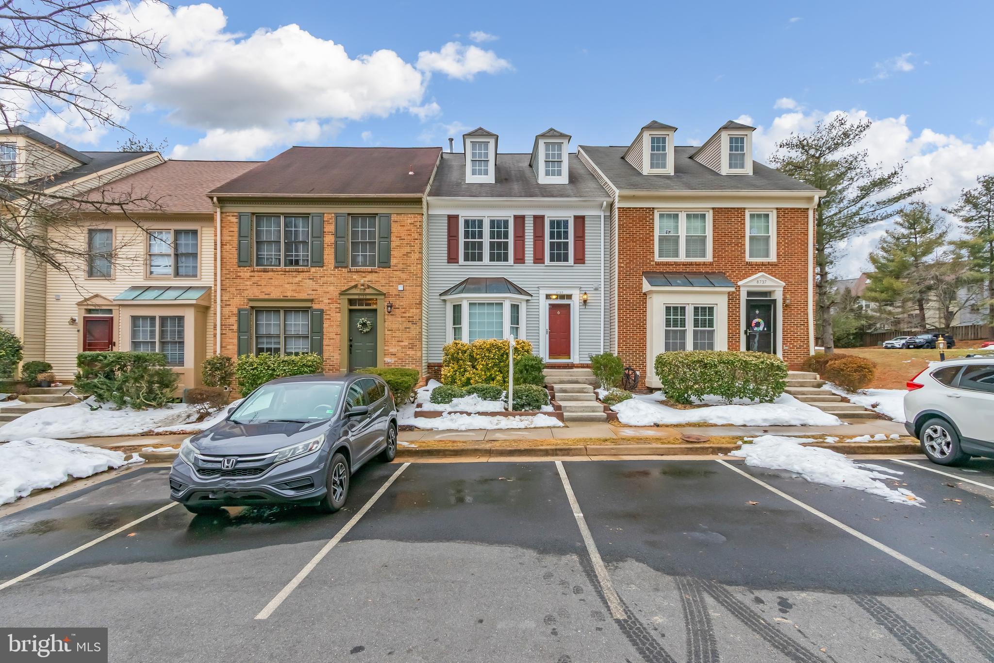 8735 Stone Hill Place Springfield, VA 22153 - Photo 51 of 51 a car parked in front of a brick house